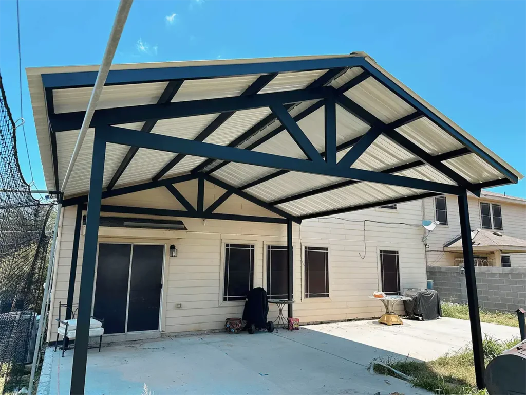 20x20 dual-slope metal roofing carport with colored metal sheets and steel framing installed at a home.